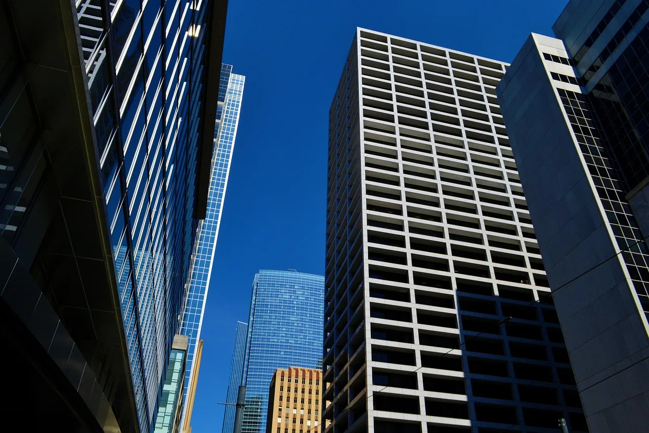 office buildings, business, downtown, business district, corporate, modern, skyline, commercial, glass, high rise, steel, architecture, contemporary, cityscape, exterior, houston, texas. California vs Texas franchise territory recruiting, registration and market tactics compared