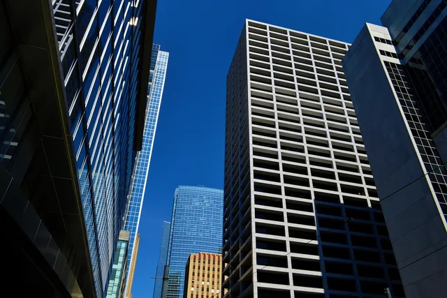office buildings, business, downtown, business district, corporate, modern, skyline, commercial, glass, high rise, steel, architecture, contemporary, cityscape, exterior, houston, texas. California vs Texas franchise territory recruiting, registration and market tactics compared